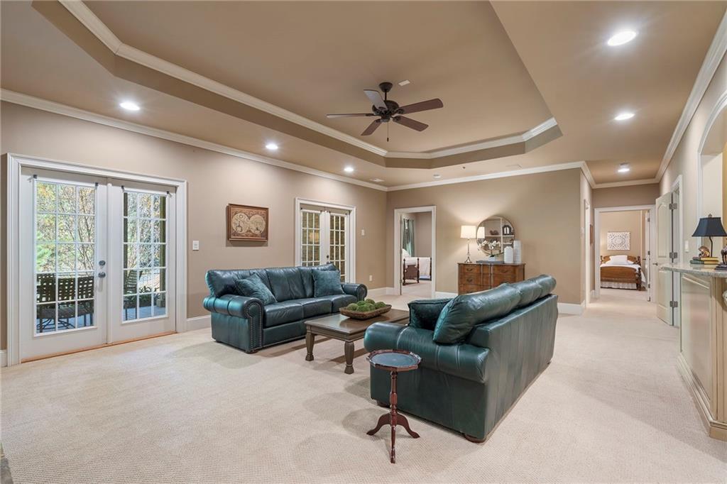 2472 Ballantrae Circle Cumming, GA 30041 - Photo 26 of 41 a living room with furniture and a large window