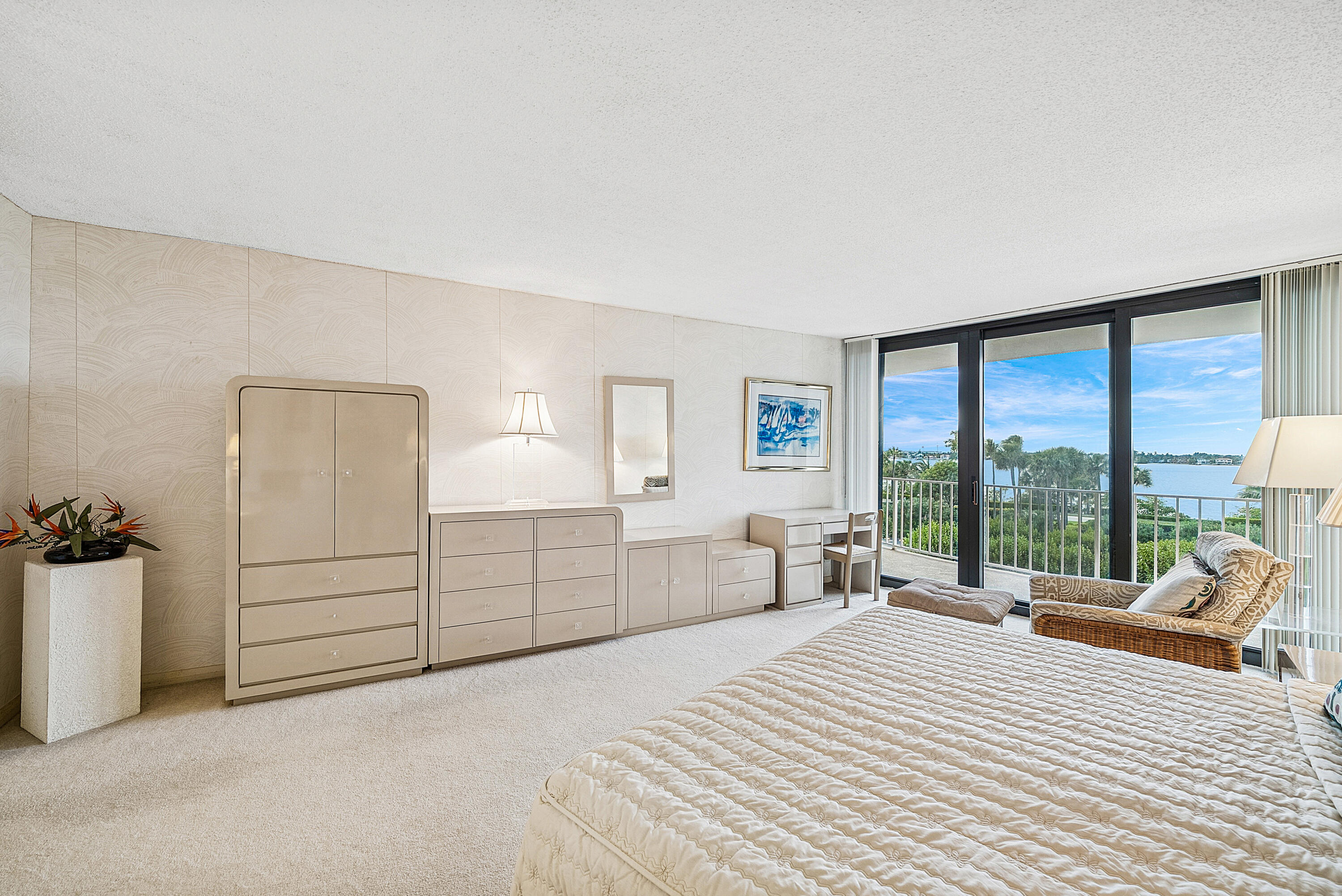 3400 South Ocean Boulevard, Unit 3HI Palm Beach, FL 33480 - Photo 15 of 50 a spacious bedroom with a bed and a large window