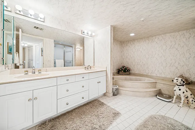 a bathroom with a bathtub and a shower