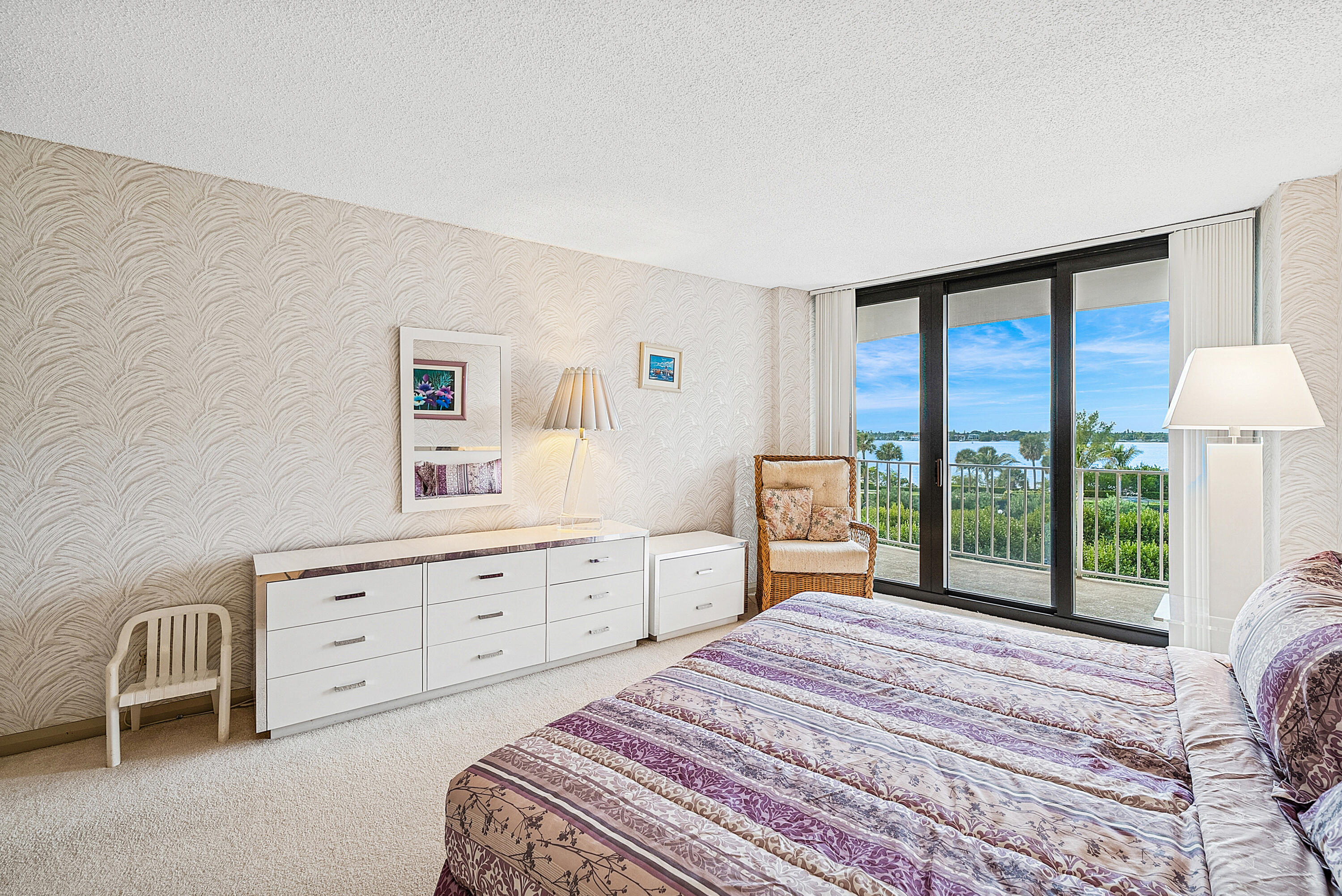 3400 South Ocean Boulevard, Unit 3HI Palm Beach, FL 33480 - Photo 19 of 50 a bedroom with a bed and a large window