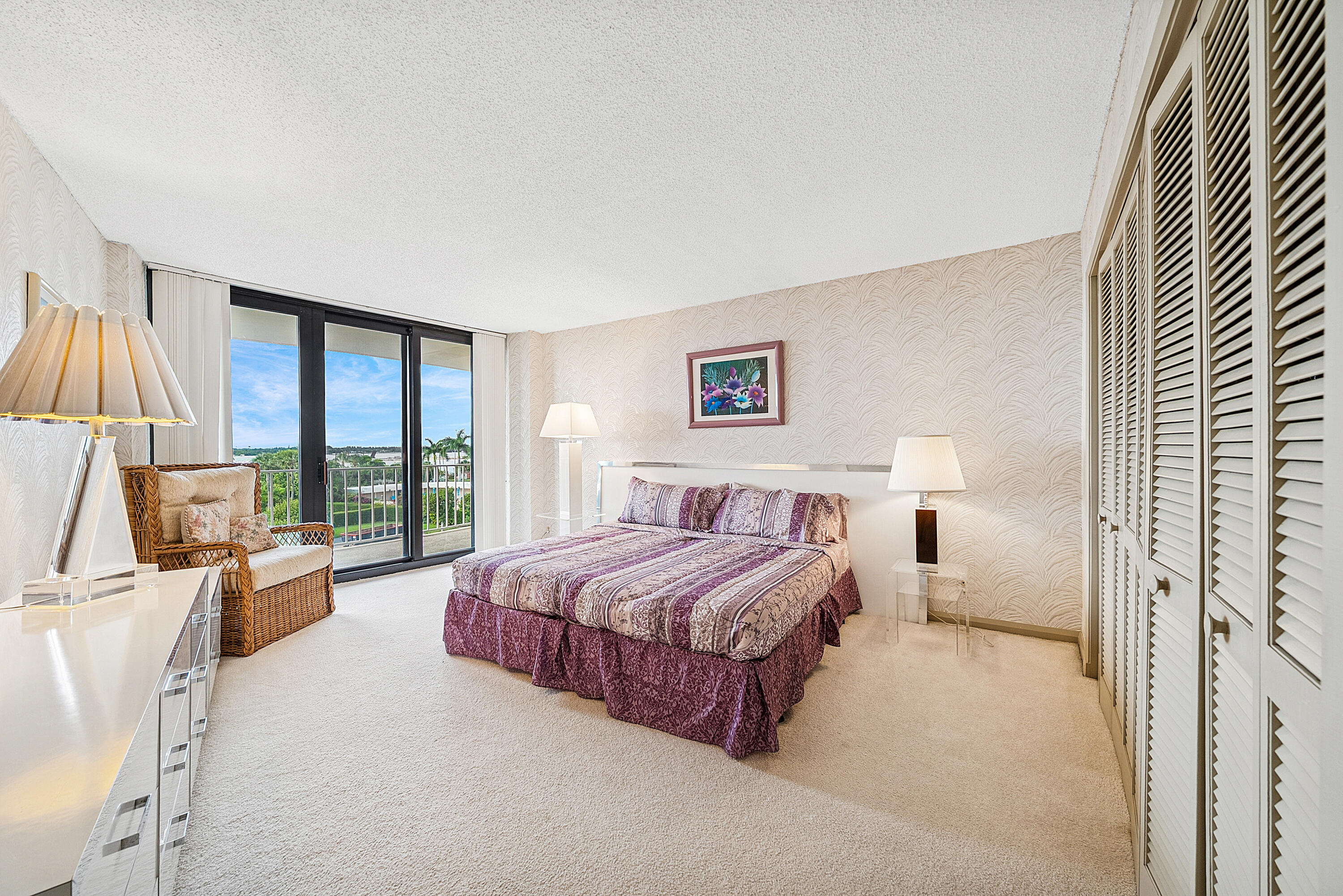 3400 South Ocean Boulevard, Unit 3HI Palm Beach, FL 33480 - Photo 20 of 50 a spacious bedroom with a large bed and a large window