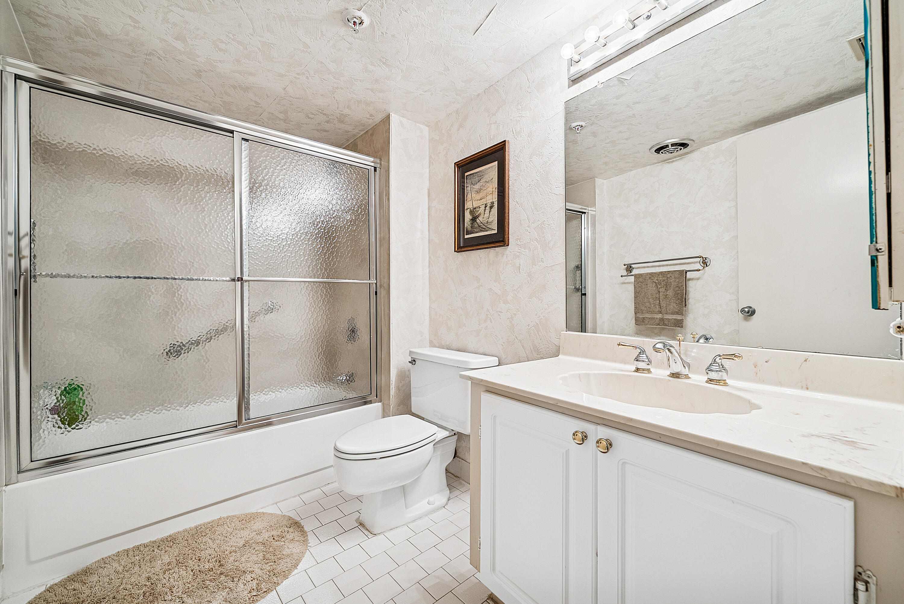 3400 South Ocean Boulevard, Unit 3HI Palm Beach, FL 33480 - Photo 21 of 50 a bathroom with a sink toilet and shower