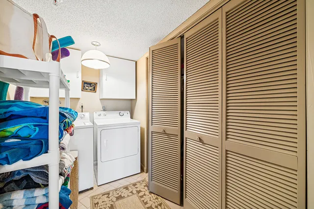 a view of a balcony with two chairs