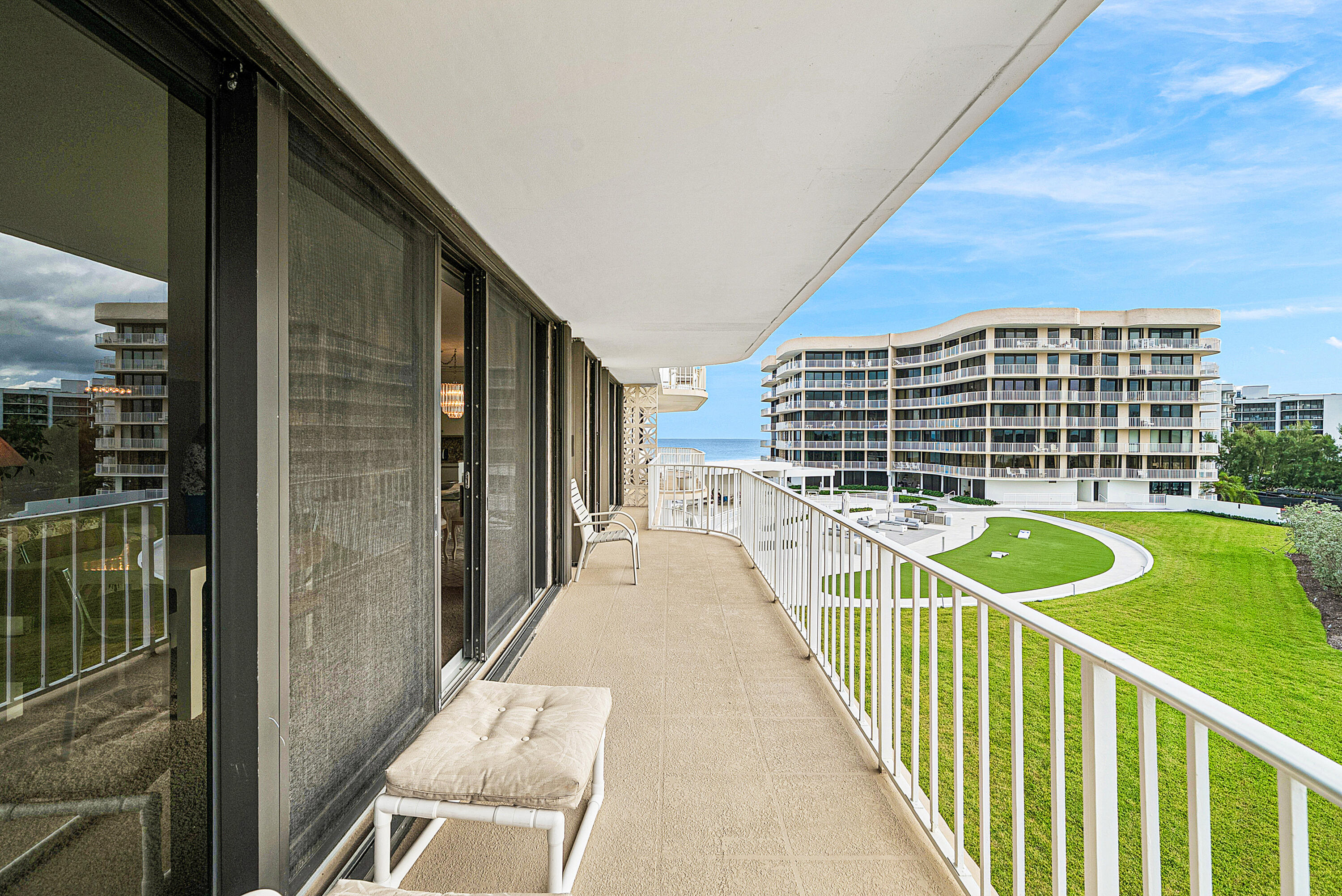 3400 South Ocean Boulevard, Unit 3HI Palm Beach, FL 33480 - Photo 26 of 50 a view of a balcony with two chairs
