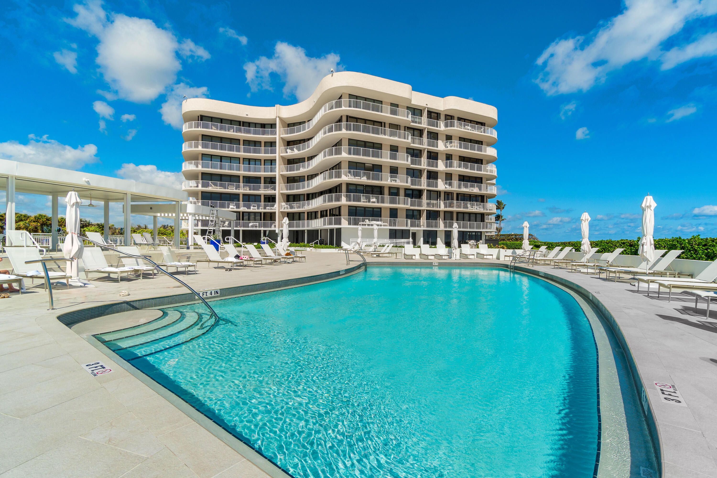 3400 South Ocean Boulevard, Unit 3HI Palm Beach, FL 33480 - Photo 29 of 50 a view of building with swimming pool and outdoor seating