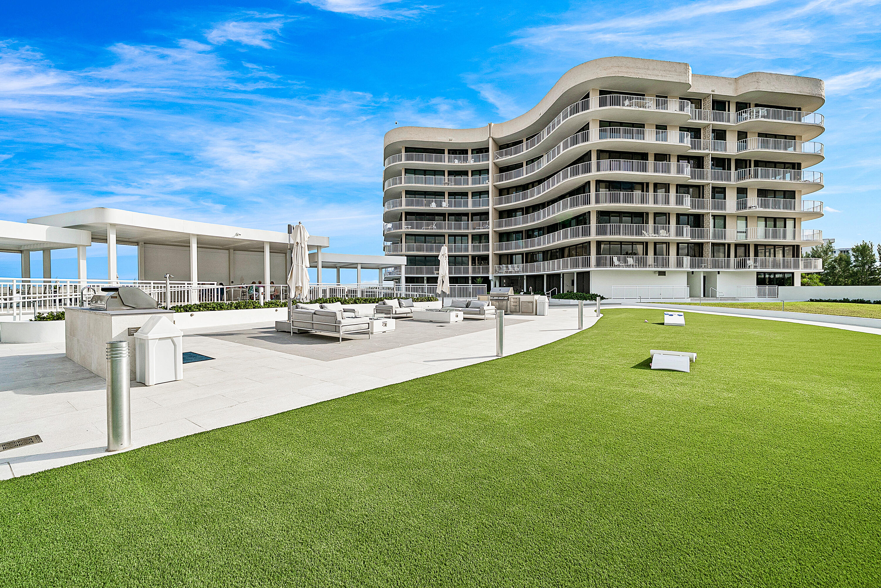 3400 South Ocean Boulevard, Unit 3HI Palm Beach, FL 33480 - Photo 31 of 50 a view of a building with a swimming pool