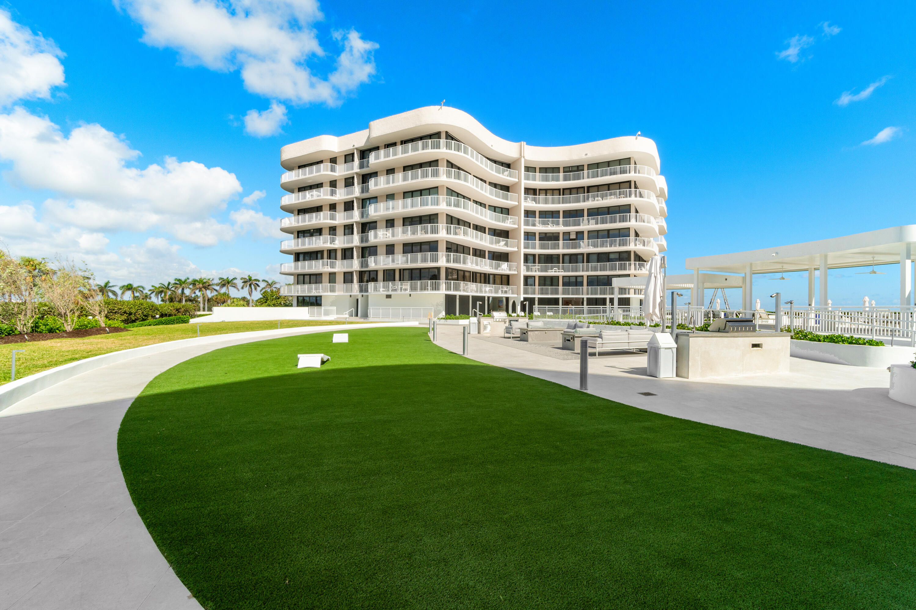 3400 South Ocean Boulevard, Unit 3HI Palm Beach, FL 33480 - Photo 43 of 50 a view of a building with a big yard