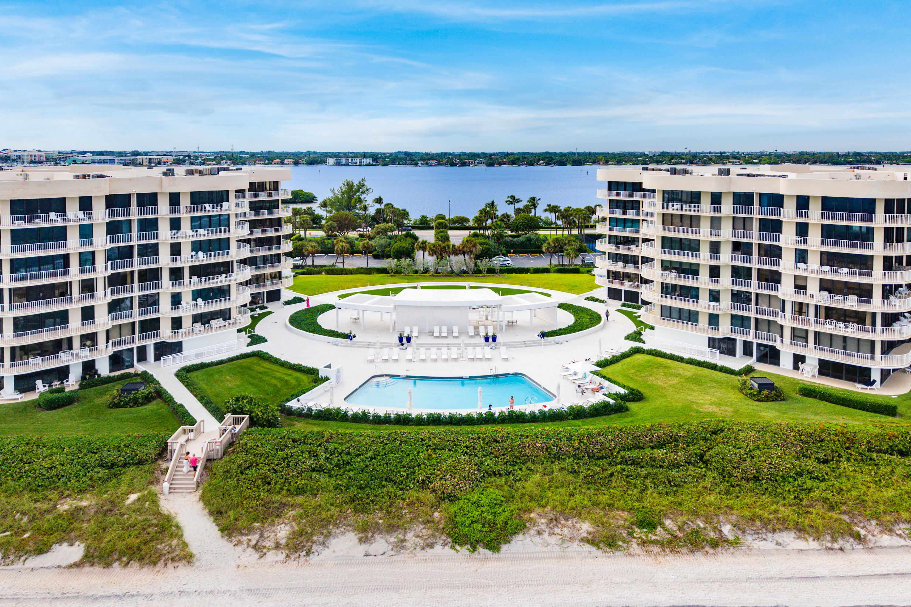 3400 South Ocean Boulevard, Unit 3HI Palm Beach, FL 33480 - Photo 46 of 50 a view of a swimming pool with a garden