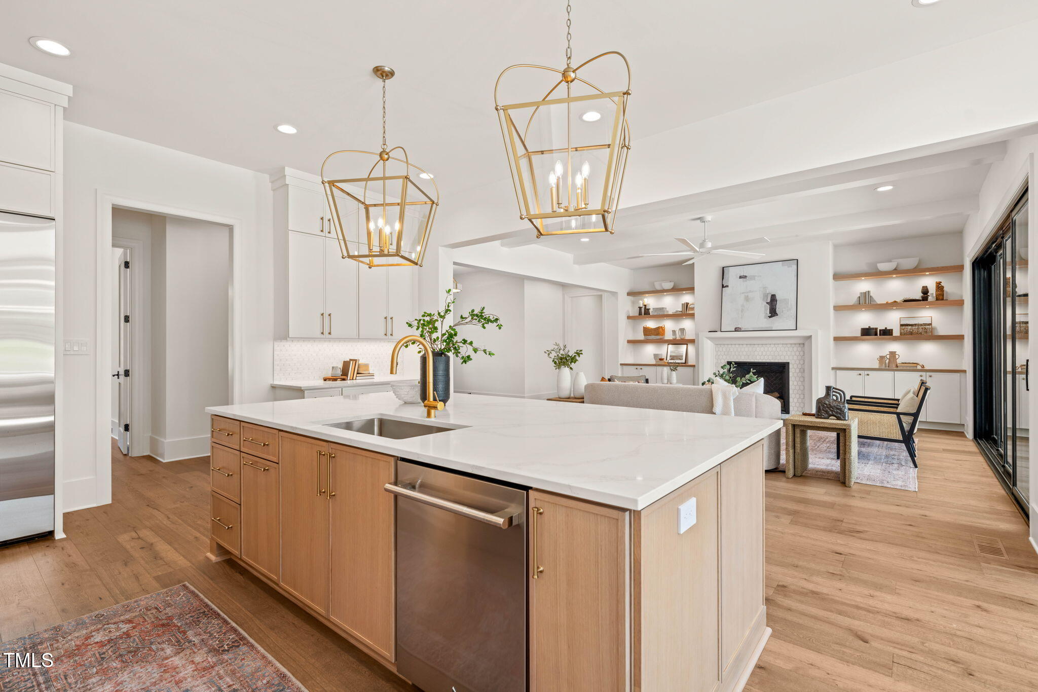 1608 Legacy Ridge Lane Wake Forest, NC 27587 - Photo 15 of 74 a room with kitchen island a sink and stove