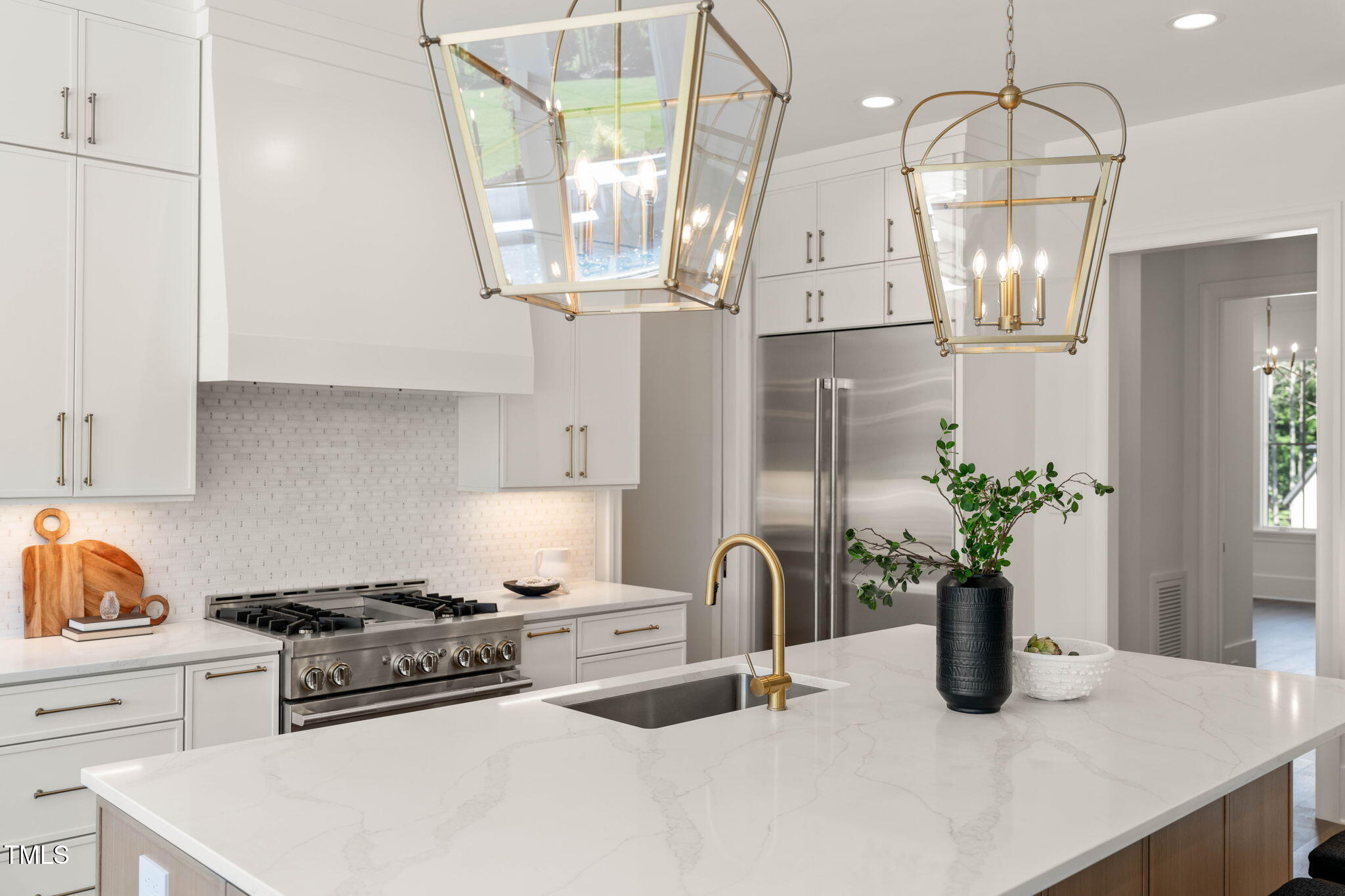 1608 Legacy Ridge Lane Wake Forest, NC 27587 - Photo 16 of 74 a kitchen with stainless steel appliances granite countertop a sink a stove and cabinets