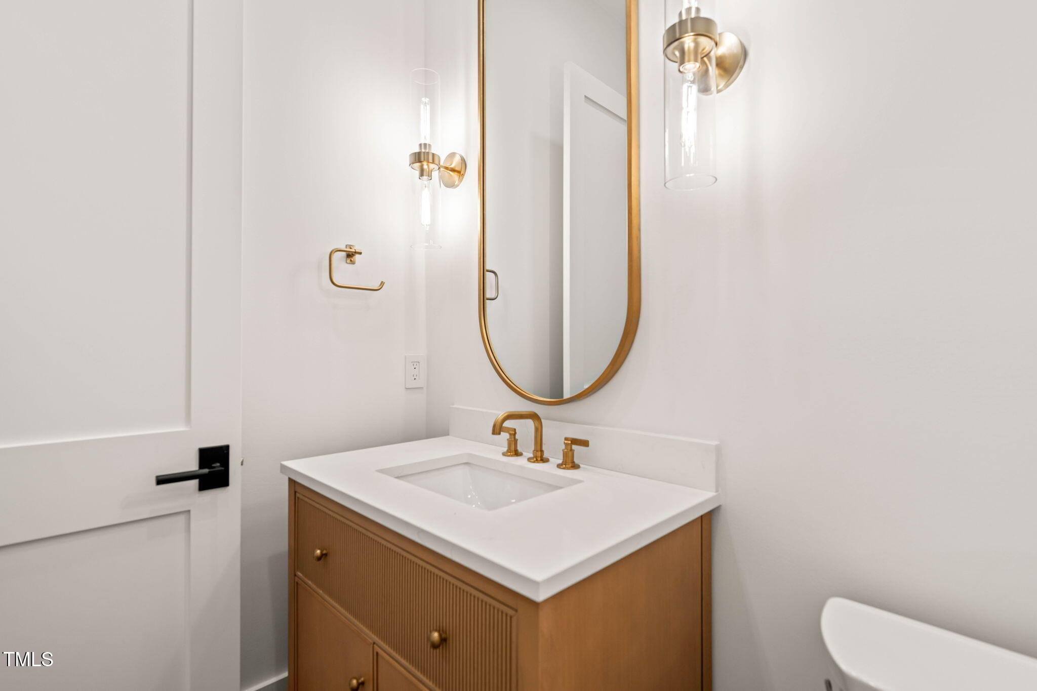 1608 Legacy Ridge Lane Wake Forest, NC 27587 - Photo 27 of 74 a bathroom with a sink and a mirror