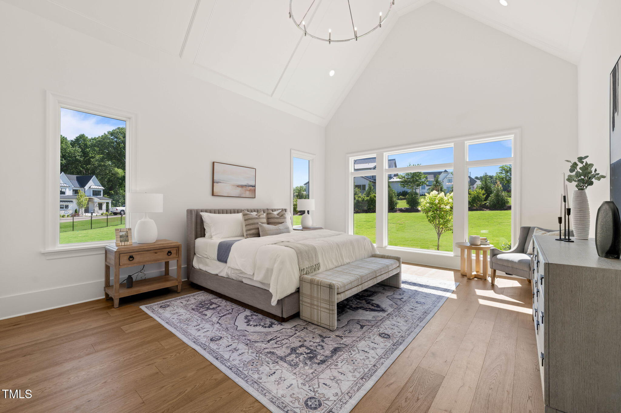 1608 Legacy Ridge Lane Wake Forest, NC 27587 - Photo 34 of 74 a bed room with a bed a couch and a window