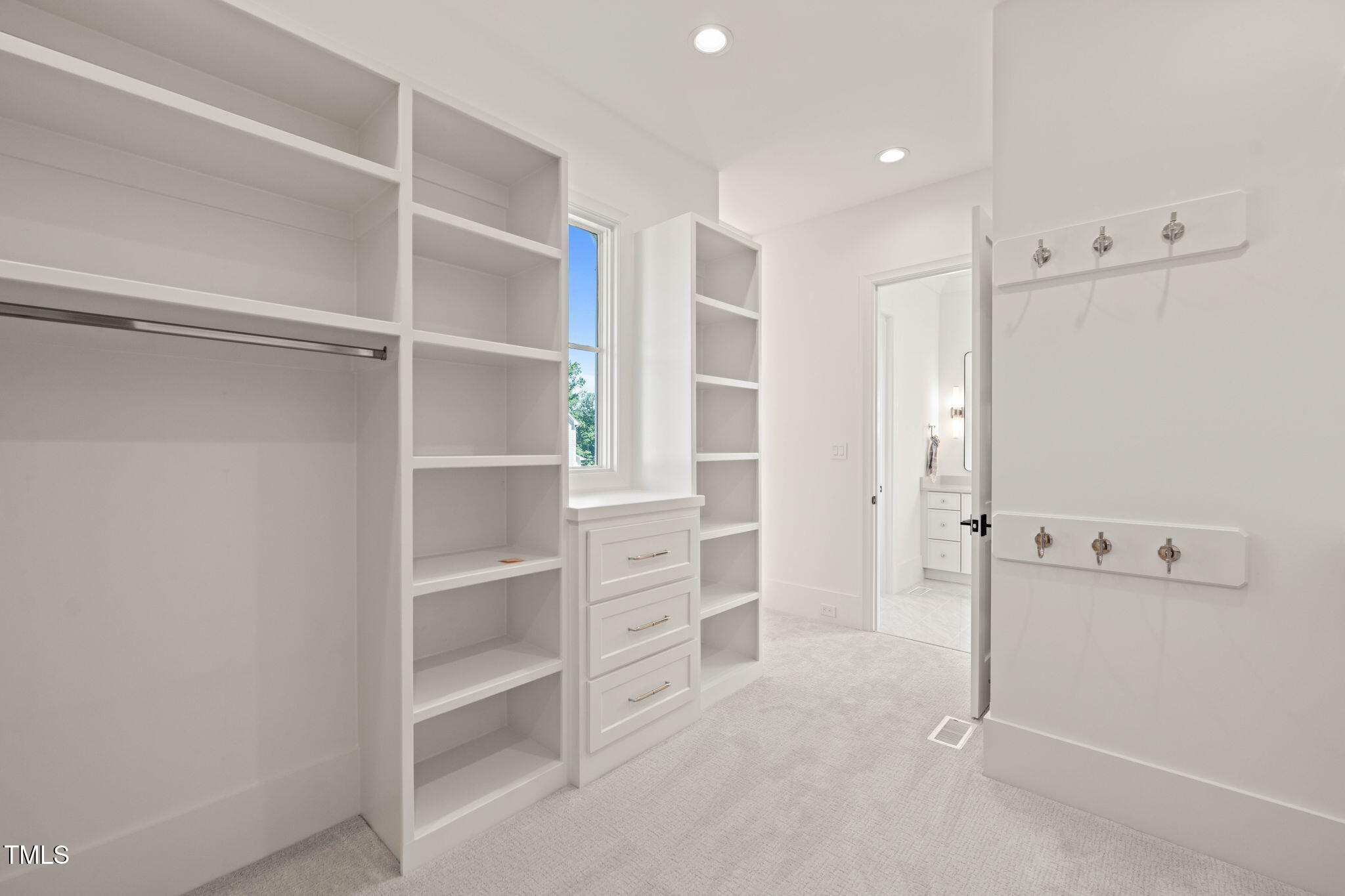 1608 Legacy Ridge Lane Wake Forest, NC 27587 - Photo 42 of 74 a view of walk in closet with empty racks