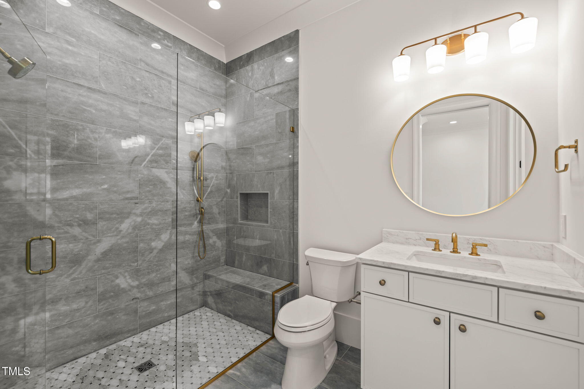 1608 Legacy Ridge Lane Wake Forest, NC 27587 - Photo 46 of 74 a bathroom with a sink a toilet and shower