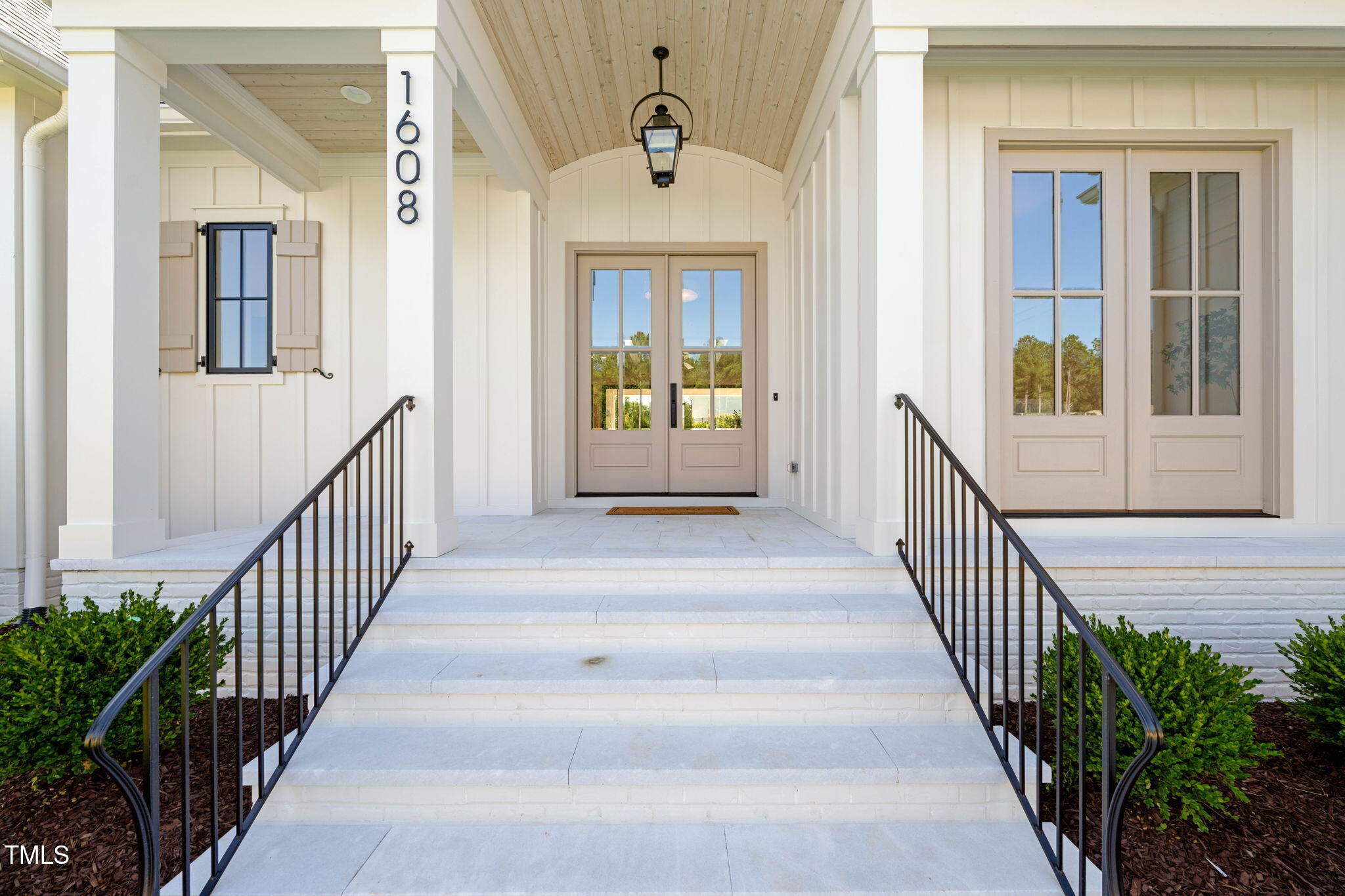 1608 Legacy Ridge Lane Wake Forest, NC 27587 - Photo 5 of 74 a view of a hallway with wooden floor and windows