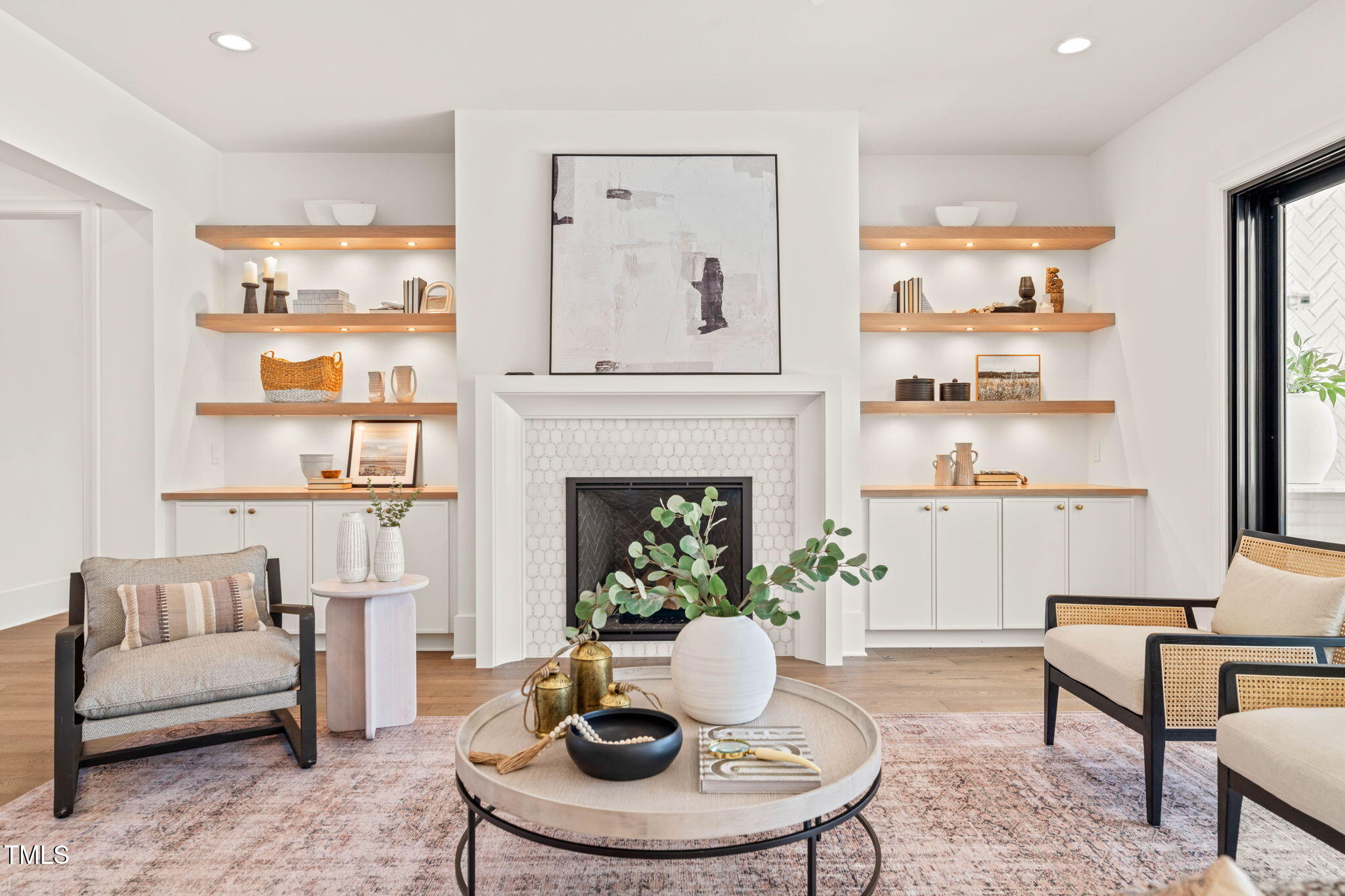 1608 Legacy Ridge Lane Wake Forest, NC 27587 - Photo 9 of 74 a living room with furniture a lamp and a fireplace