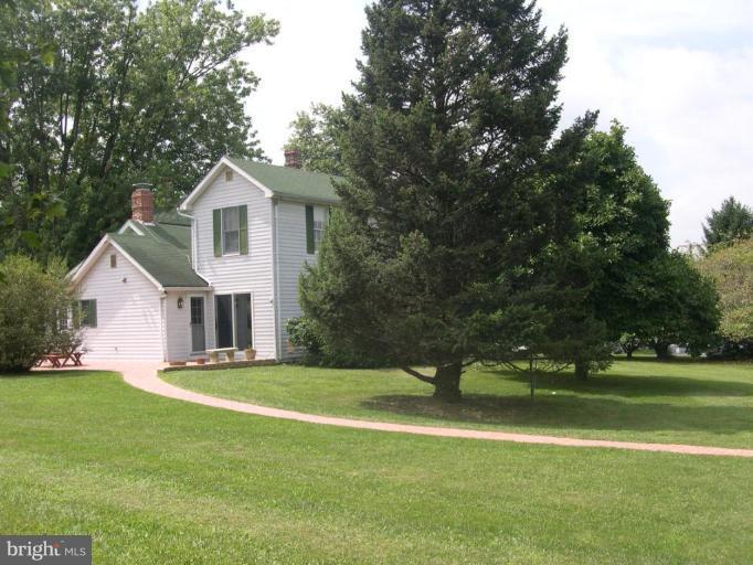 13575 Pleasantville Road Baldwin, MD 21013 - Photo 2 of 21 a front view of a house with a yard