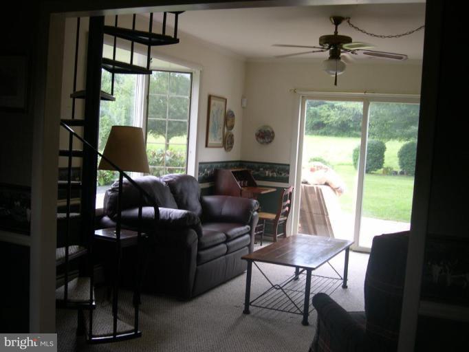 13575 Pleasantville Road Baldwin, MD 21013 - Photo 11 of 21 a living room with furniture and a window