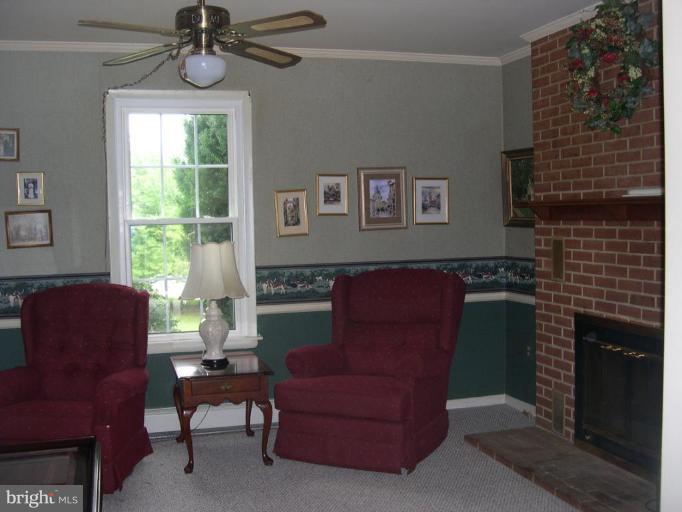 13575 Pleasantville Road Baldwin, MD 21013 - Photo 13 of 21 a living room with furniture and a window