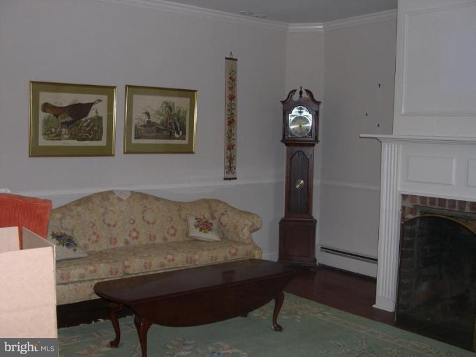 13575 Pleasantville Road Baldwin, MD 21013 - Photo 15 of 21 a living room with furniture and a fireplace