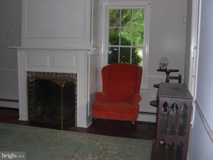 13575 Pleasantville Road Baldwin, MD 21013 - Photo 16 of 21 a living room with furniture and a fireplace
