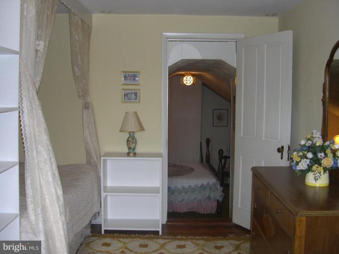13575 Pleasantville Road Baldwin, MD 21013 - Photo 21 of 21 a view of hallway with livingroom and furniture