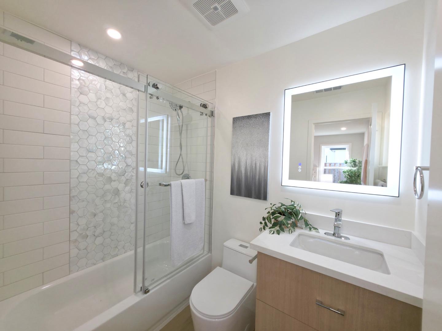 6746 Bollinger Road San Jose, CA 95129 - Photo 17 of 30 a bathroom with a sink toilet and shower