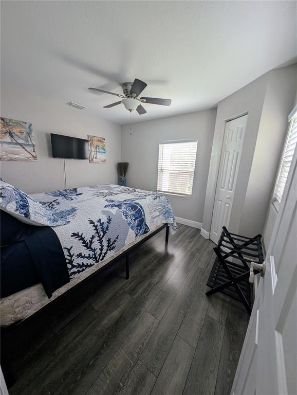 2190 South Seaport Point Crystal River, FL 34429 - Photo 15 of 40 a bedroom with a bed ceiling fan and a window