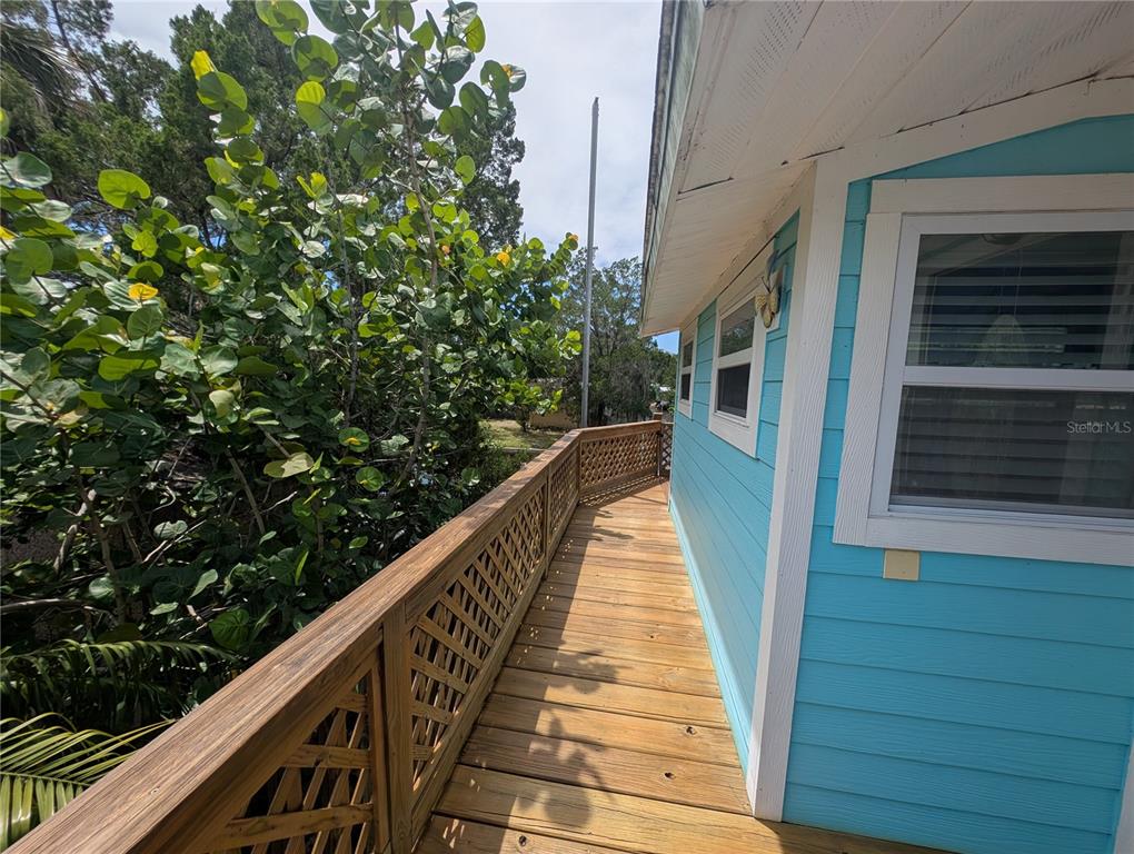 2190 South Seaport Point Crystal River, FL 34429 - Photo 35 of 40 a view of balcony with wooden floor and fence