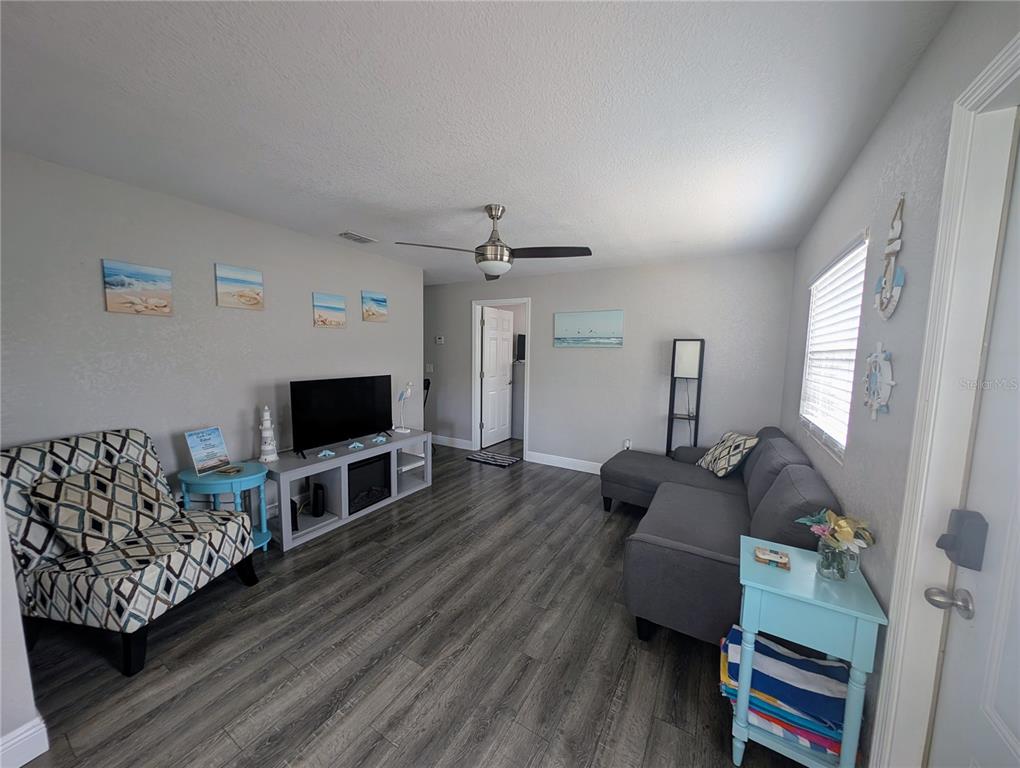 2190 South Seaport Point Crystal River, FL 34429 - Photo 4 of 40 a living room with furniture and a flat screen tv