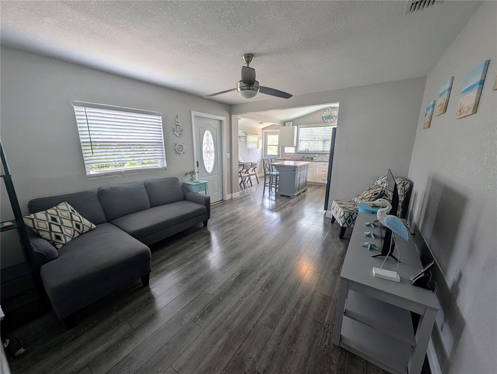 2190 South Seaport Point Crystal River, FL 34429 - Photo 5 of 40 a living room with furniture dining table and a window