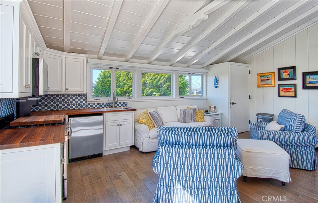 681 Seaview Street, Unit B Laguna Beach, CA 92651 - Photo 11 of 15 a bedroom with furniture and a large window