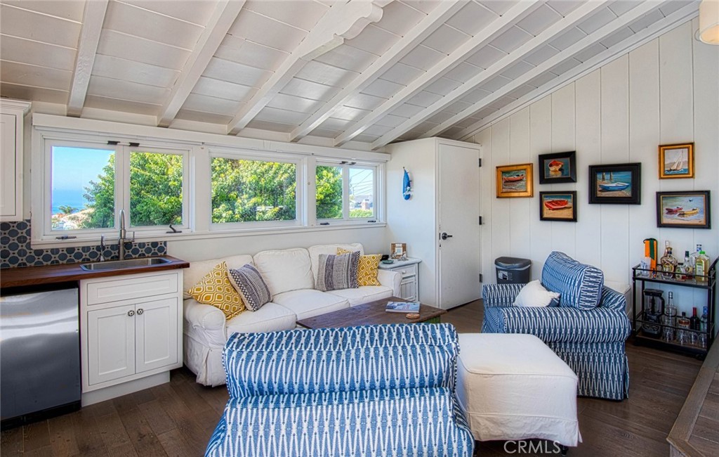 681 Seaview Street, Unit B Laguna Beach, CA 92651 - Photo 14 of 15 a living room with furniture and a large window