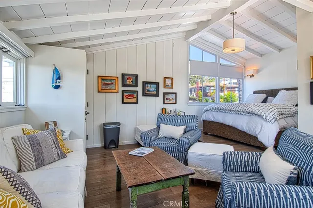 a bedroom with furniture and a window