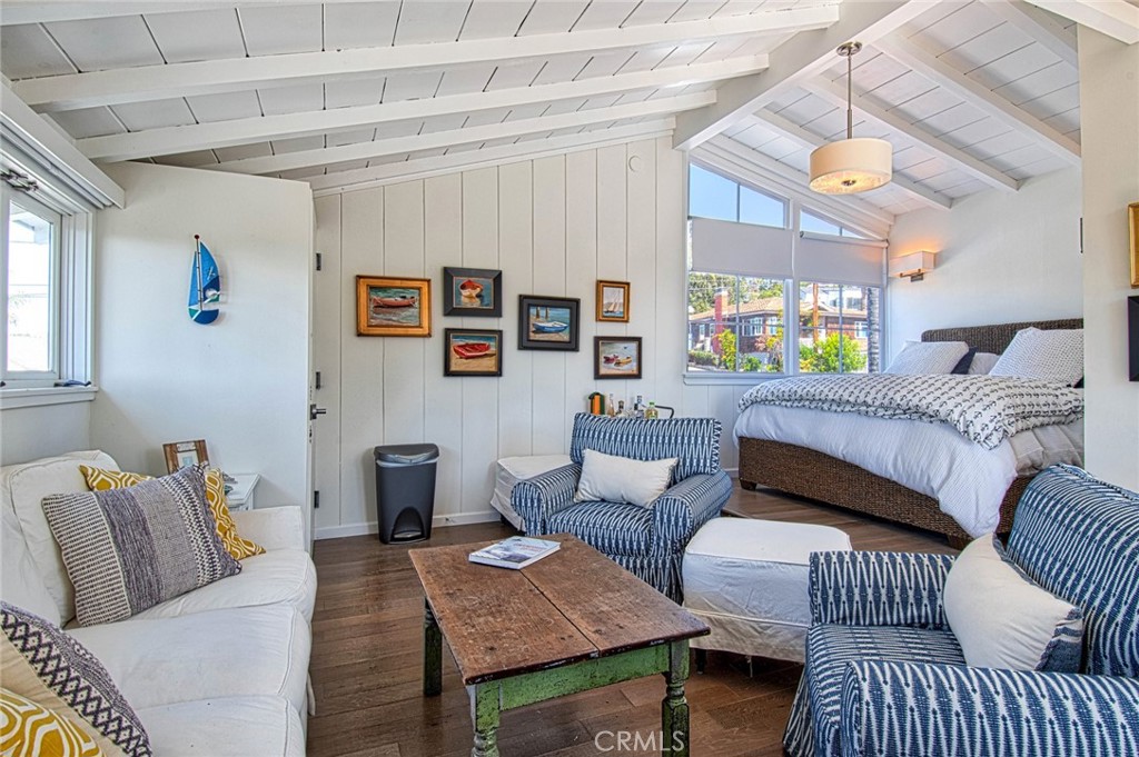 681 Seaview Street, Unit B Laguna Beach, CA 92651 - Photo 4 of 15 a bedroom with furniture and a window