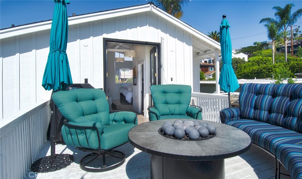 681 Seaview Street, Unit B Laguna Beach, CA 92651 - Photo 7 of 15 a living room with furniture and a fireplace