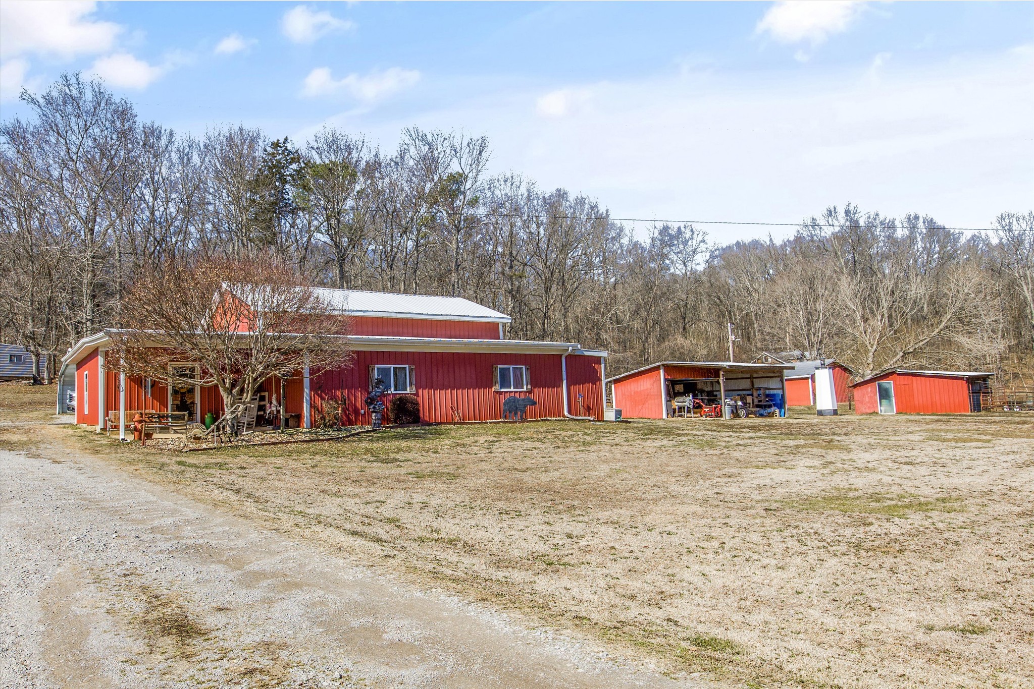840 Bates Hollow Road Prospect, TN 38477 - Photo 3 of 54 a view of a house with large trees and fence