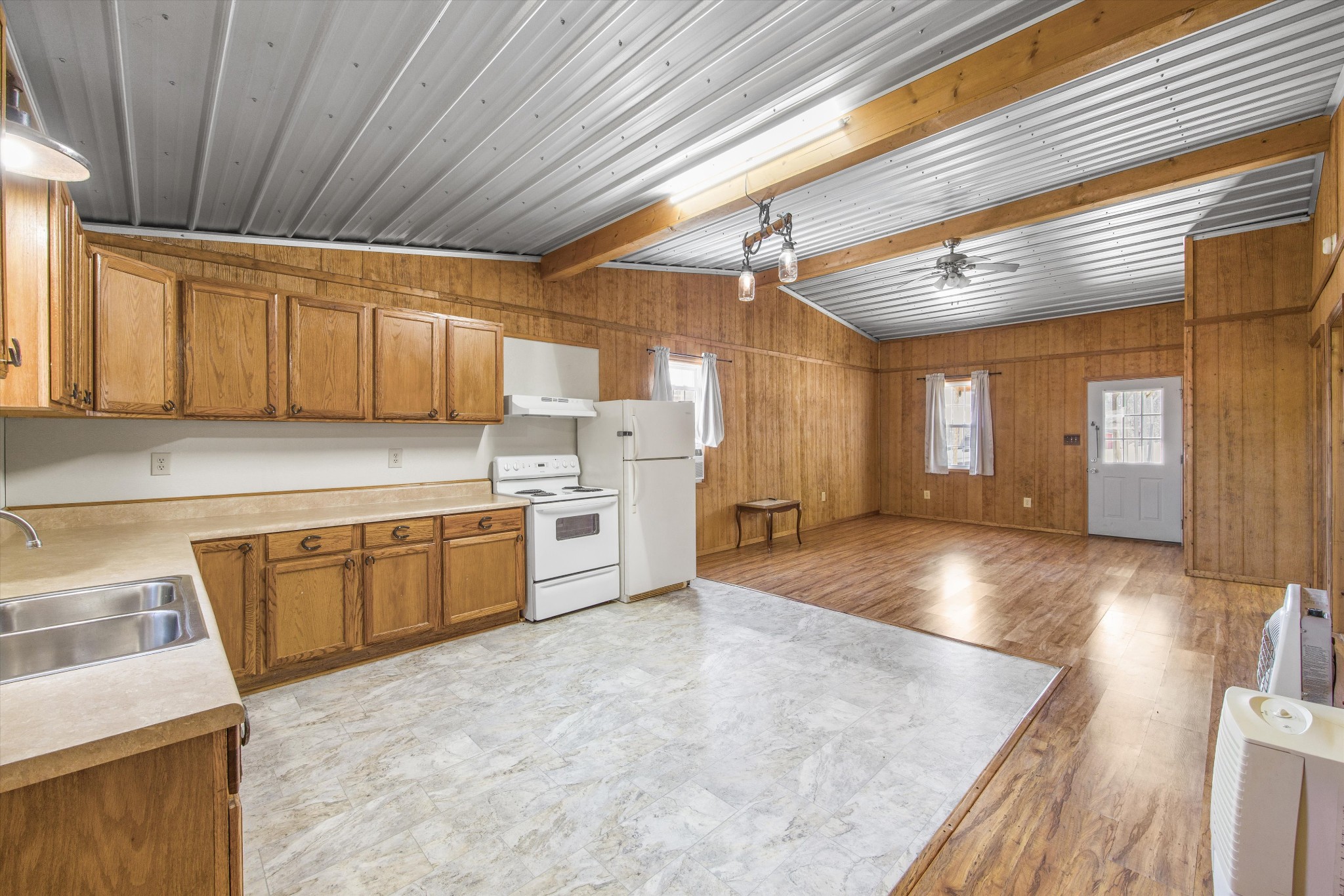 840 Bates Hollow Road Prospect, TN 38477 - Photo 32 of 54 a kitchen with stainless steel appliances granite countertop a sink a stove counter space and cabinets
