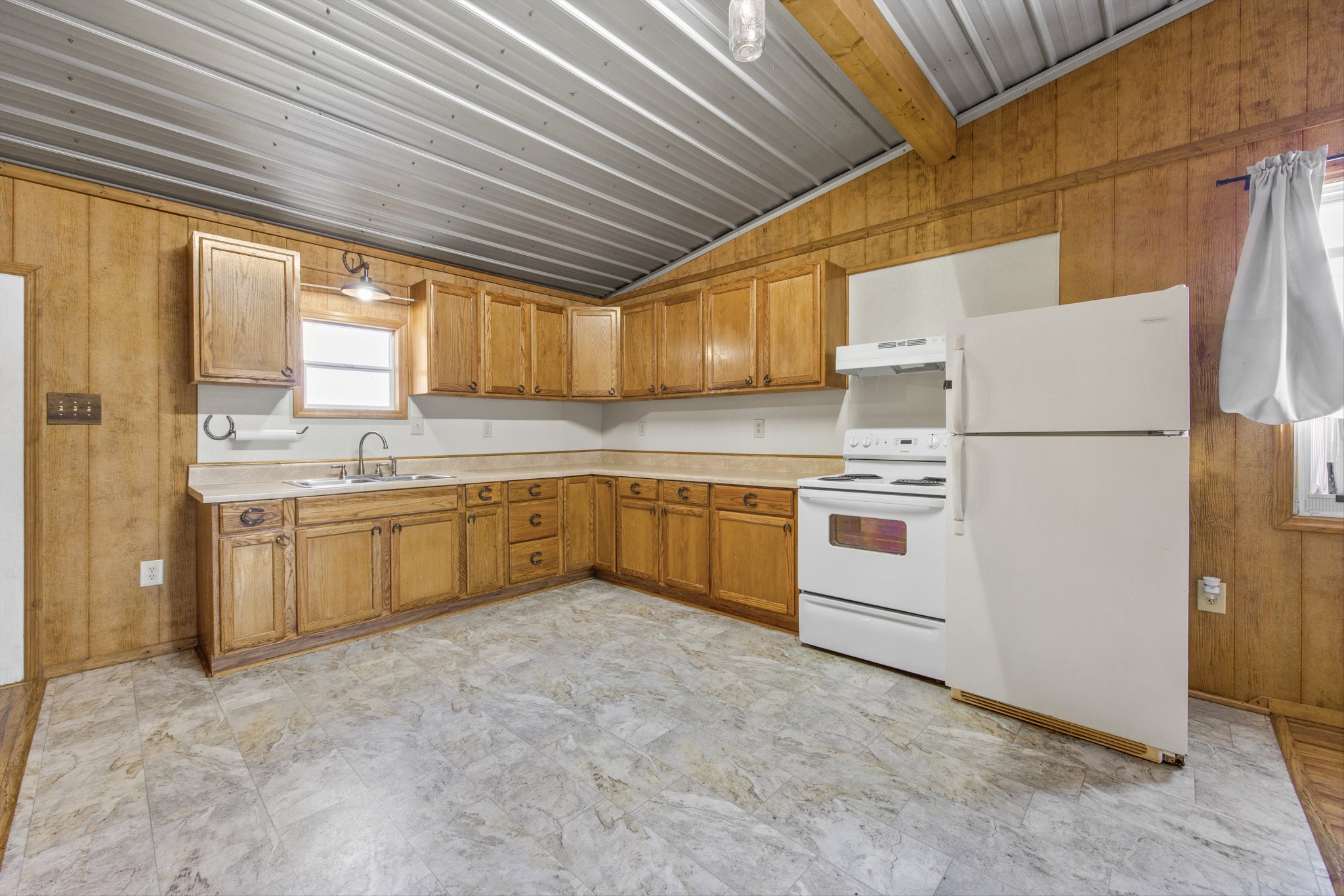 840 Bates Hollow Road Prospect, TN 38477 - Photo 33 of 54 a kitchen with a white cabinets and white appliances