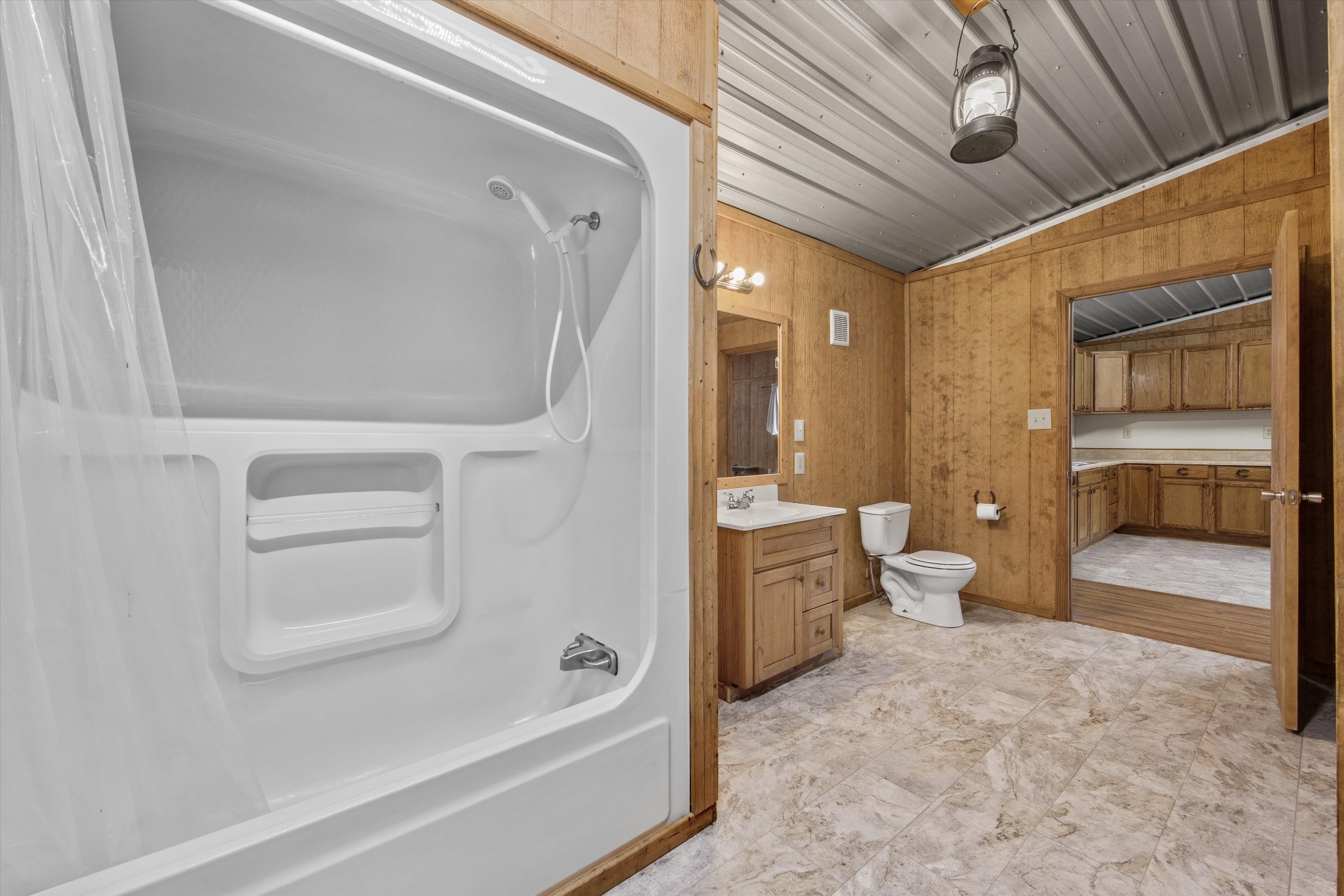 840 Bates Hollow Road Prospect, TN 38477 - Photo 35 of 54 a bathroom with a toilet a sink and bathtub