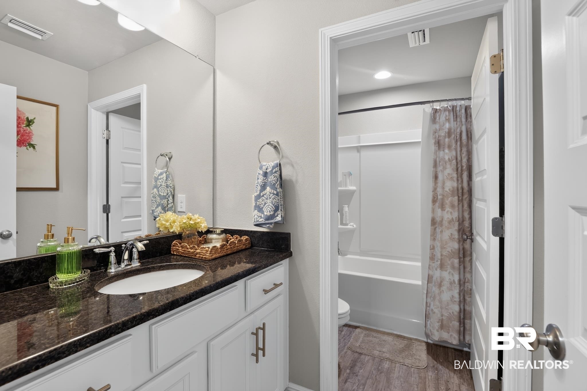 1210 Primrose Lane Foley, AL 36535 - Photo 18 of 33 Bathroom featuring a white vanity with dark countertop, an integrated sink, and a large wall-mounted mirror