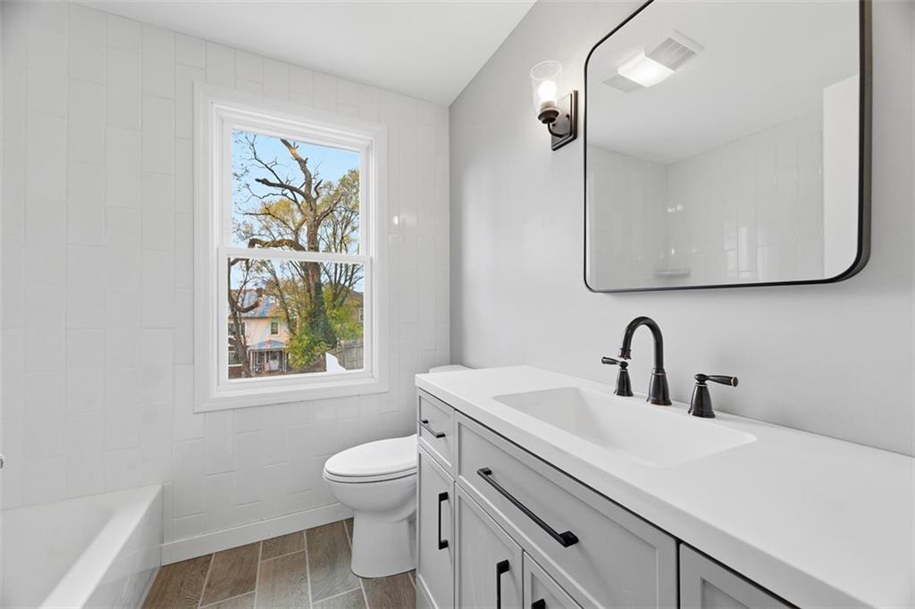 2214 Saranac Avenue Pittsburgh, PA 15216 - Photo 20 of 39 a bathroom with a sink vanity mirror and toilet
