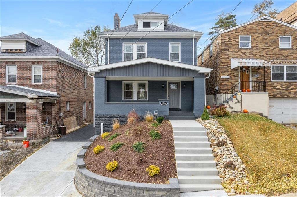 2214 Saranac Avenue Pittsburgh, PA 15216 - Photo 2 of 39 a front view of a house with a yard