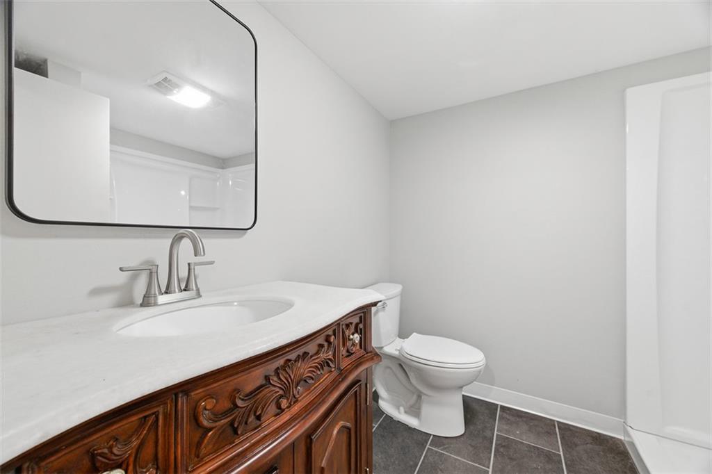 2214 Saranac Avenue Pittsburgh, PA 15216 - Photo 28 of 39 a bathroom with a sink a toilet and mirror