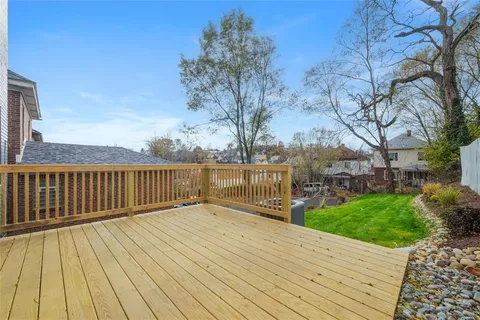 a view of balcony with wooden floor