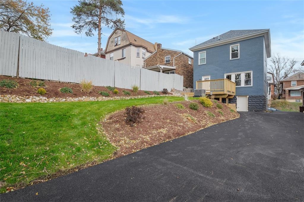 2214 Saranac Avenue Pittsburgh, PA 15216 - Photo 34 of 39 a view of a house with a yard