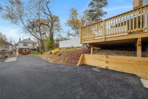 a view of a house with a yard balcony
