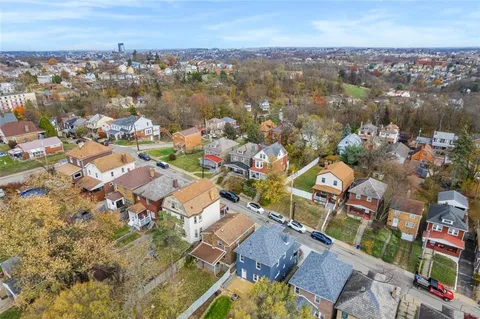an aerial view of a city with lots of residential buildings