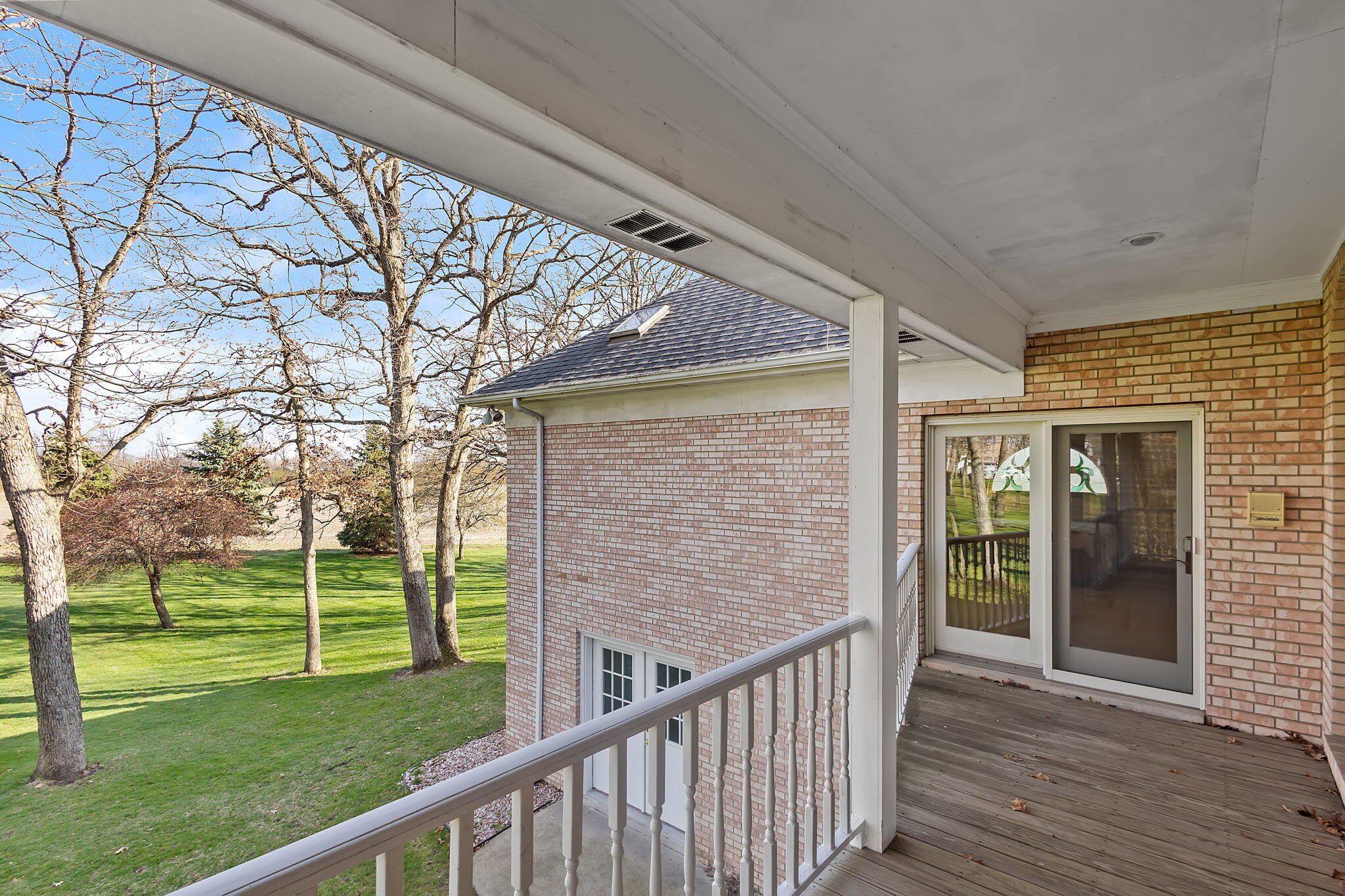 6664 Ridgeview Drive Demotte, IN 46310 - Photo 12 of 65 a view of a porch in front of a house with a big yard