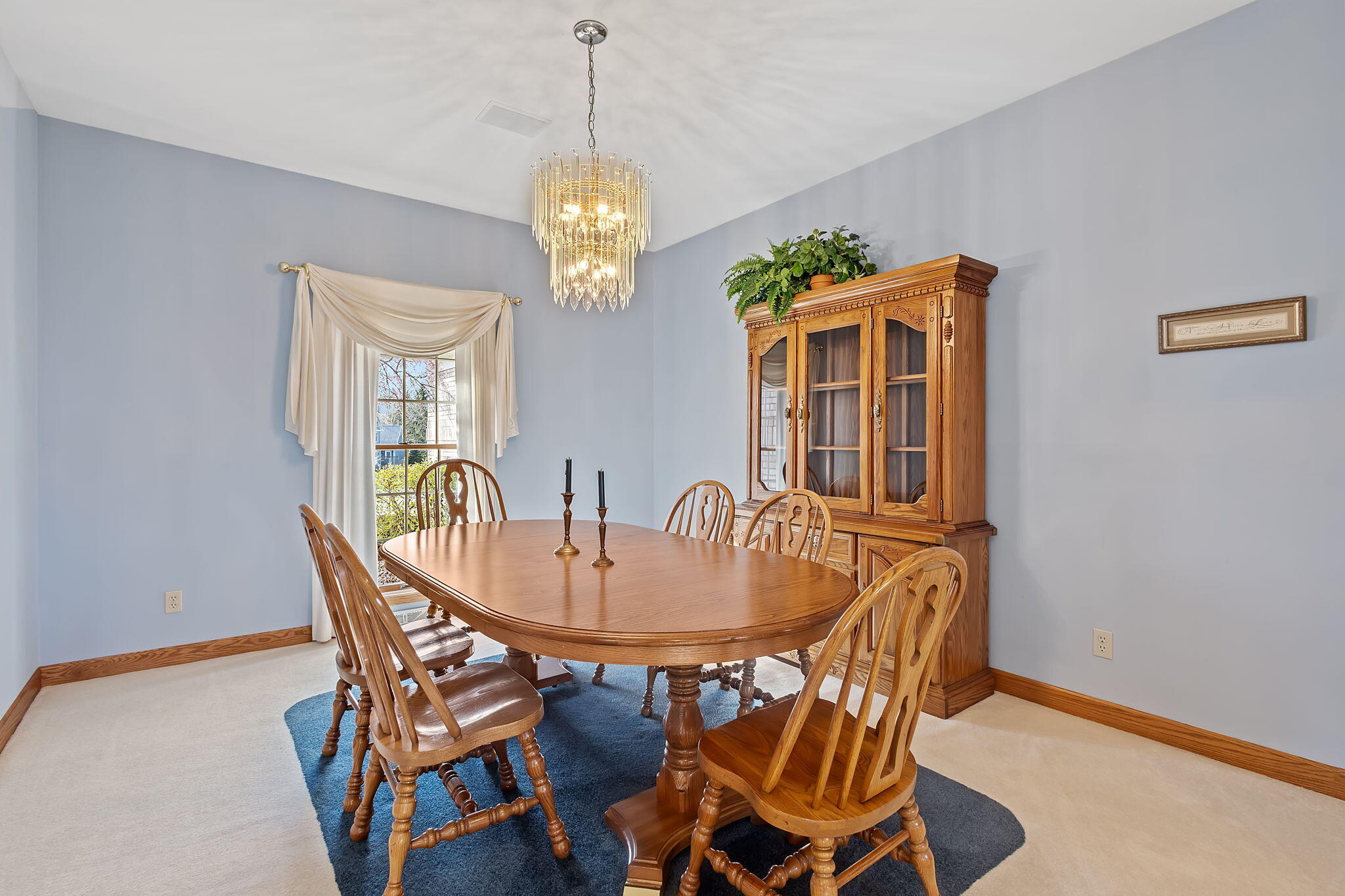 6664 Ridgeview Drive Demotte, IN 46310 - Photo 13 of 65 a view of a dining room with furniture wooden floor and chandelier